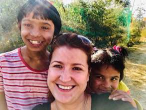 Saraswoti smiling with visitors