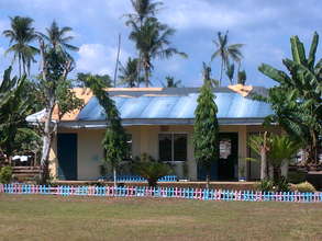 Ira's classroom roof is still covered in tarps