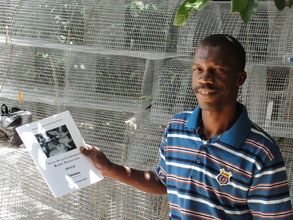 A proud recipient of a manual on meat production