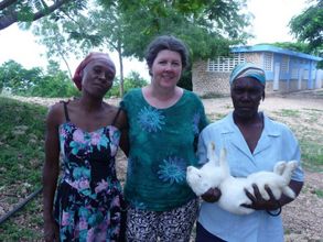FTF Volunteer with rabbit producers