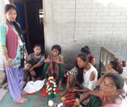 Phulmaya teaching weaving in her local place