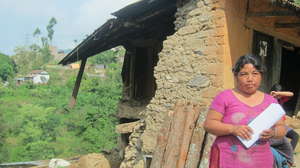 Grantee partner Esha Tamang infront of her home