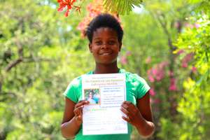 Receiving her diploma after a week at DAKTARI!