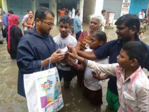 Fellow supports his community during floods...