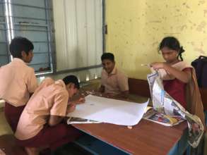 Students working on School House events