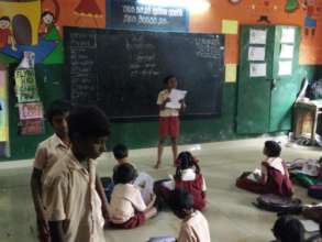 Grade 5 student teaching students in Grade 2