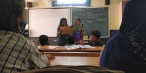 Students paired up to read story books