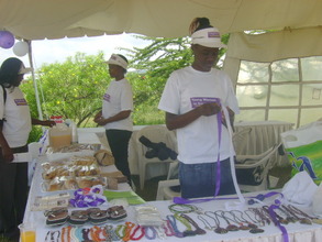 YWE girls displaying their products