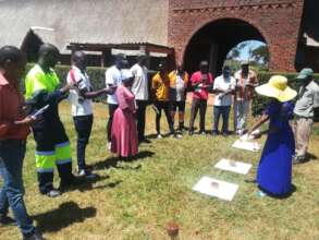 Participants observe soil and water demonstrations