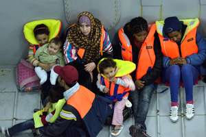 A family rescued from a sinking boat