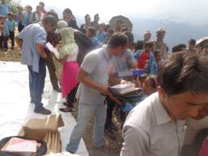 Students receiving long awaited exercise books