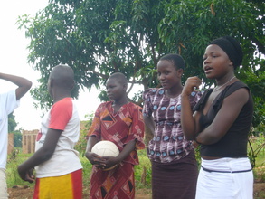 An Adolescent Club Mentor (right) leads a discussion