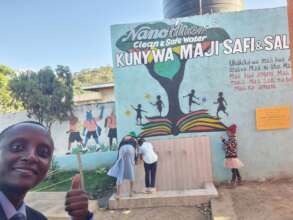 Children enjoying water at Elimu Yetu Tanzania