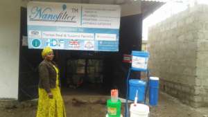 Rehema at her well-branded water station