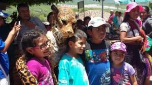 Children interact with Jaguara