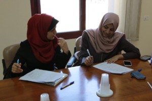 Students filling out applications in Gaza