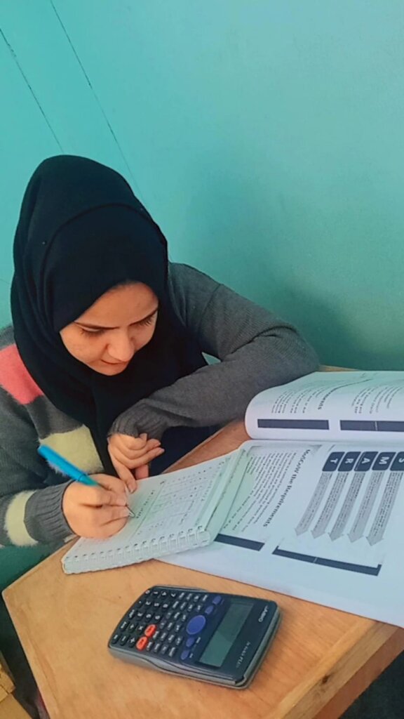 Lina hard at work with her books