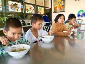 Children of the Shelter Enjoying a Meal Together