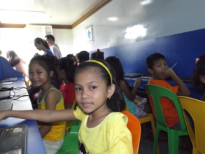 Cherrevie smiles as she starts her computer lesson