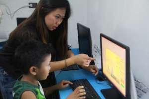 Raymart with IT Teacher Joem in computer lesson