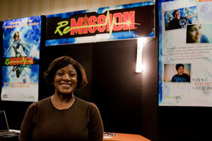 Robin Avant stands in front of our booth.