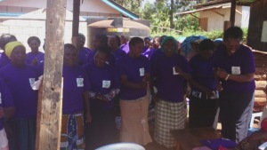 Ndia women happily receiving T-shirts from Grace-W
