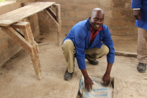 Elisha Kayange working on science laboratory