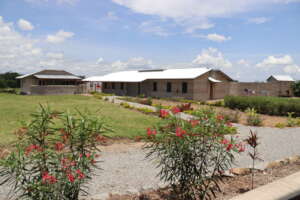 First dorm at Milembe with Hygiene Building