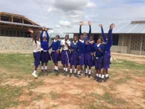 Students in front of new dorm and hygiene building