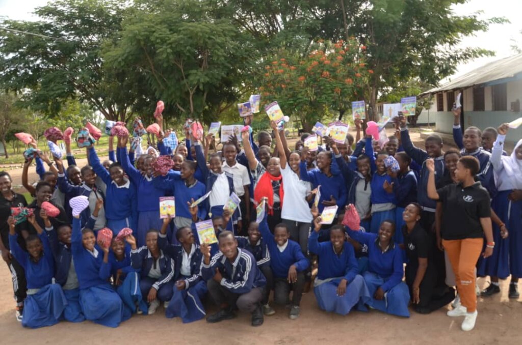 Milembe students with books donated by TGFT.