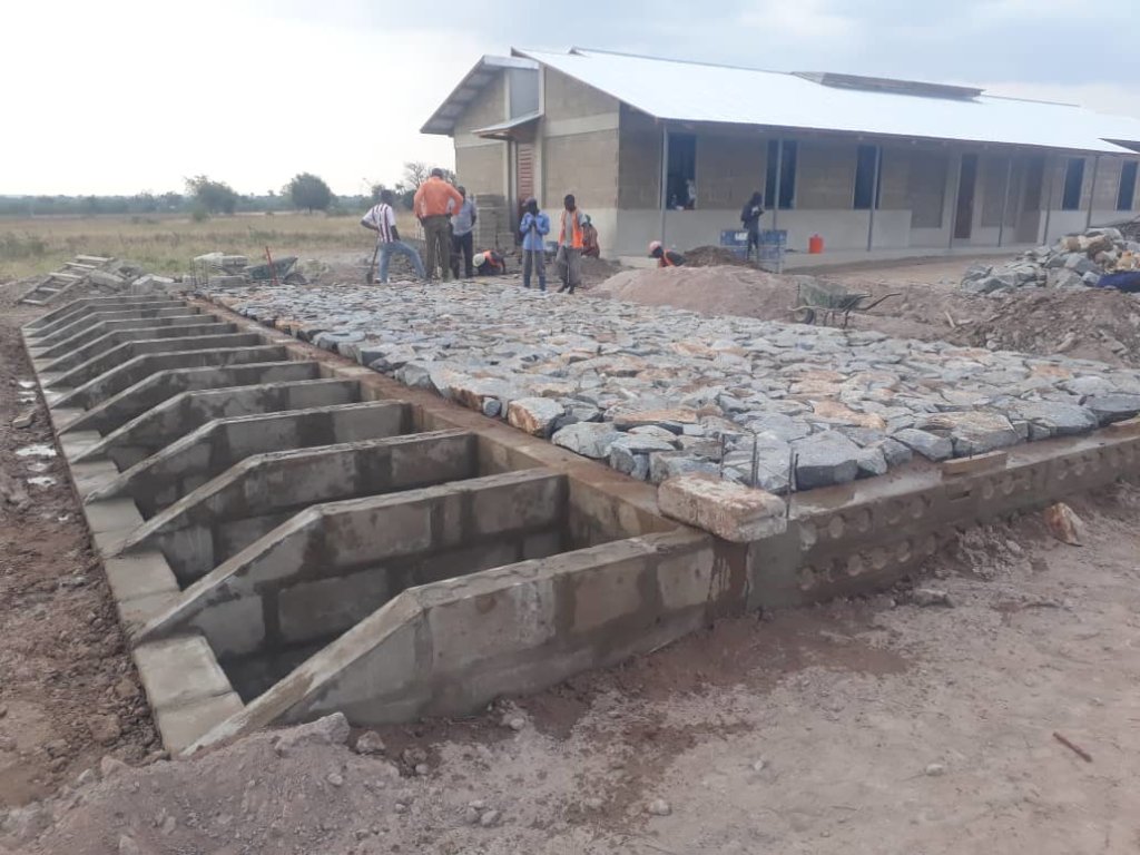 Hygiene building foundation and dorm in background