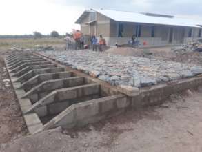 Hygiene building foundation and dorm in background
