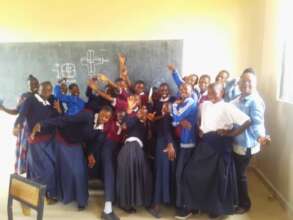 Teacher Oliver with the girls at Sumwa Secondary.