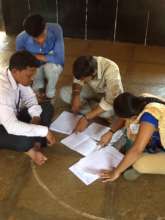 Youth volunteers, correcting the question papers