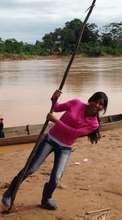 Aracely playing on the Bolivian riverbank