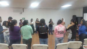 Coordinators lead participants in an ice breaker.