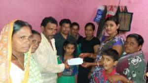 Photo of handing over the cheque to Krupa