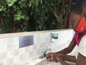 Using the new handwashing station on reopening day