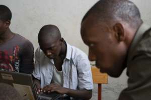 Eric (center) in IT class