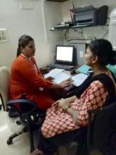 Sunita, Social Worker with a beneficiary parent