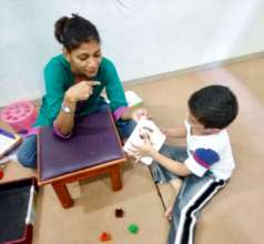 A child receiving speech therapy