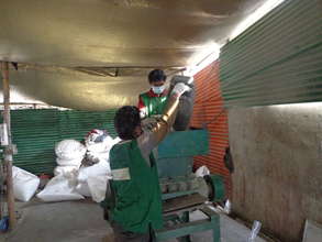 Wastepickers Bailing the PET Bottles