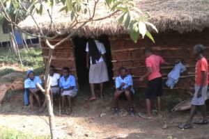 Kids relax in the shade of our new mushroom house