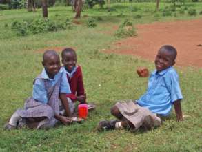 3rd-grade girls enjoying their lunch in the shade