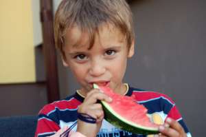 Nico (6 years old) eating his favorite fruit.