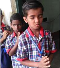 Samapan at prayer in the school