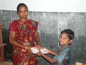 A student receives note books