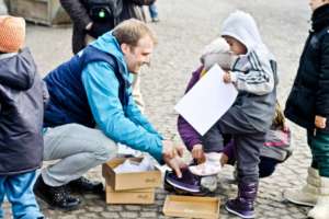 New boots for the refugee child.