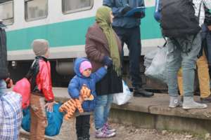 Refugee families are entering the train to Croatia