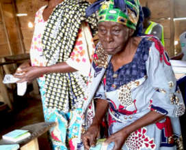 Displaced women prepare to submit vouchers